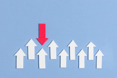 Distinct red arrow pointing white arrows