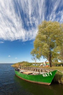 Fishing boat in small harbour of the Achterwasser at Warthe near Rankwitz on Usedom island in the Baltic Sea