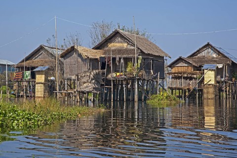 Intha lakeside village with traditional bamboo houses on stilts in Inle Lake