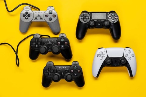 Different generations of game controllers of the Playstation game console