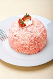 Fresh pink strawberry and whipped cream dessert macro close up