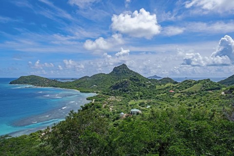 View over Chatham Bay and green hills on Union Island