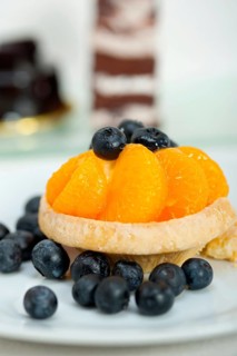 Fresh blueberry and tangerine orange cream cupcake homemade closeup macro
