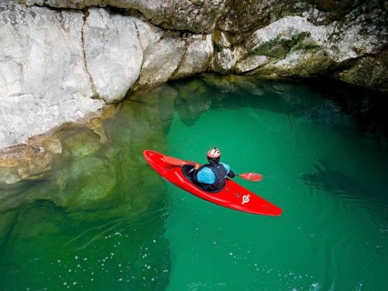 Kayakers on the emerald green Soca River