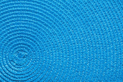 Close-up of the blue texture of a braided mat