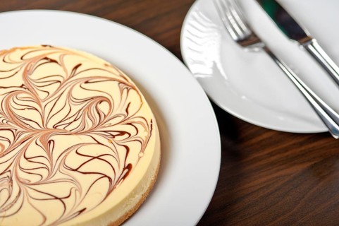 Fresh baked classic Cheese cake with chocolate topping