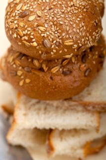 Fresh organic bread over rustic table macro closeup