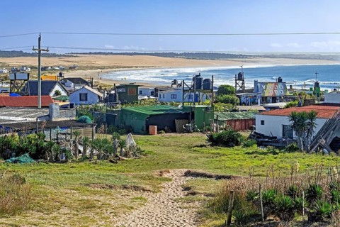 Colourful houses in the hamlet Cabo Polonio along the Atlantic Ocean coast