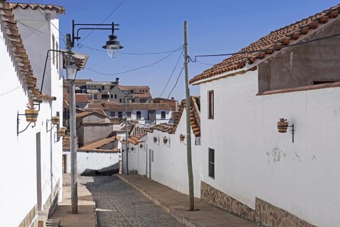 Alley with white houses in the Spanish colonial quarter of the capital city Sucre