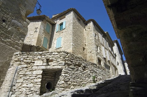 Steep alley with medieval houses in the village Gordes