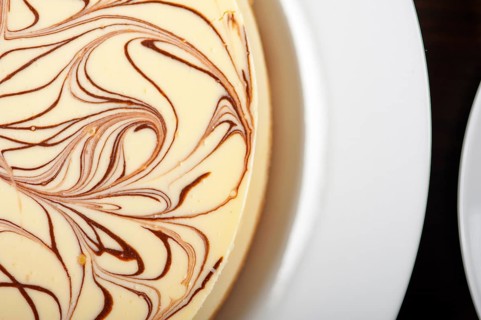 Fresh baked classic Cheese cake with chocolate topping