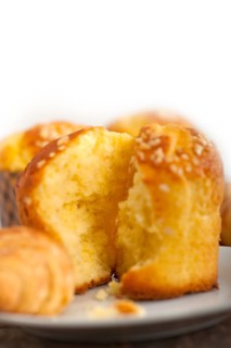 Fresh baked muffin and croissant mignon on old wood table