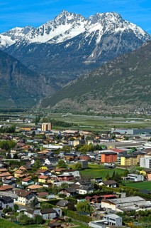 The village of Charrat in the wide Rhone valley in Lower Valais