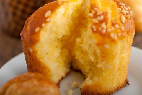Fresh baked muffin and croissant mignon on old wood table