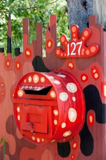 Modern Aboriginal art on a letterbox at the entrance to a house
