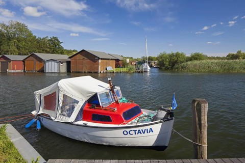 Wooden boat houses on the banks of the Plauer See at Plau am See