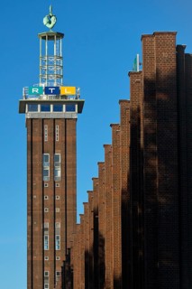 Trade fair tower with RTL logo and Hermes faces by Hans Wissel