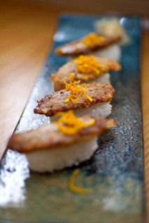 Japanese style sushi fried goose liver macro closeup