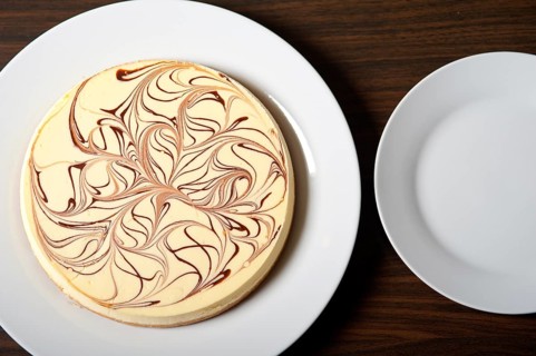 Fresh baked classic Cheese cake with chocolate topping