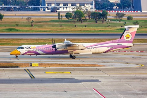 A De Havilland Canada Dash 8 Q400 aircraft of NokAir with registration HS-DQB at Bangkok Don Mueang Airport