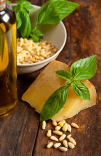 Italian basil pesto ingredients over old wood macro