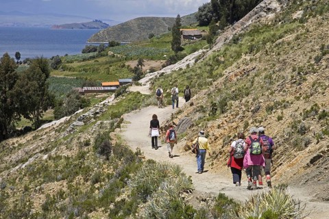 Tourists hiking on the island Isla del Sol in Lake Titicaca