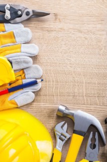 Vertical view of organised copy space with construction tools