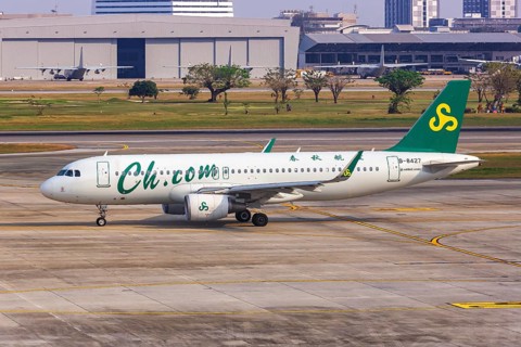 A Spring Airlines Airbus A320 aircraft with registration number B-8427 at Bangkok Don Mueang Airport