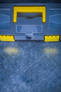 Copy space image of a closed tool set on a scratched metallic background Design concept