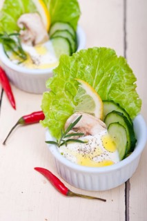 Fresh organic garlic cheese dip salad on a rustic table