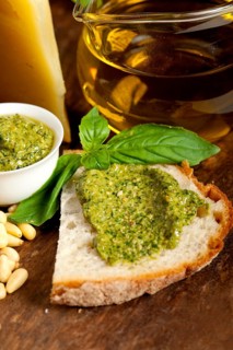 Italian basil pesto bruschetta ingredients over old wood macro