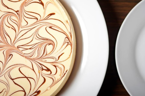 Fresh baked classic Cheese cake with chocolate topping