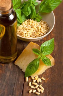 Italian basil pesto ingredients over old wood macro