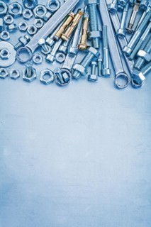 Large set of stainless steel repair tools on metallic background copyspace image construction concept