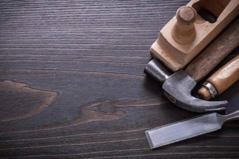 Copy space image of carpenter's tools on vintage wooden board construction concept
