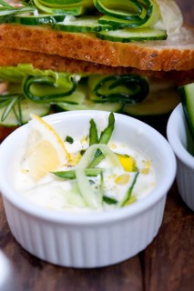 Fresh vegetarian sandwich with garlic cheese dip salad on rustic table