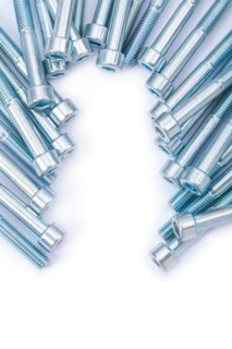 Industrial background long bolts against a white background