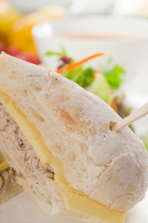 Tuna fish and cheese sandwich with fresh mixed salad