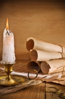 Candle and old paper roll