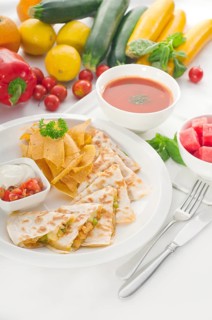 Original Mexican quesadilla de pollo with nachos served with gazpacho soup and watermelon