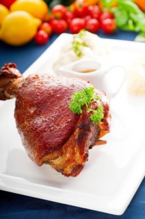 Original German BBQ pork knuckle served with mashed potatoes and sauerkraut