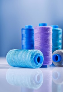 Five sewing bobbins