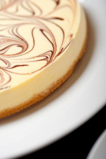 Fresh baked classic Cheese cake with chocolate topping