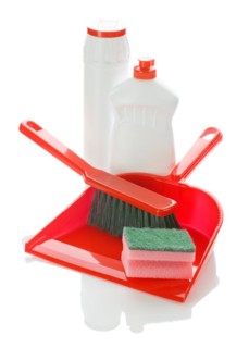 Brush on dustpan with bottles and sponge