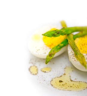 Boiled fresh green asparagus and eggs with extra virgin olive oil