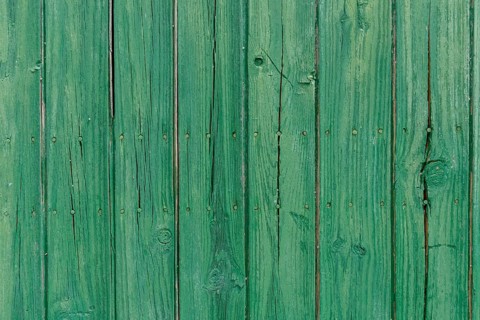 Old wooden door with aged metal door handle. Architectural textured background