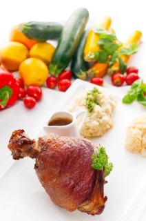 Original German BBQ pork knuckle served with mashed potatoes and sauerkraut