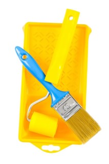 Paint roller and brush on the paint box