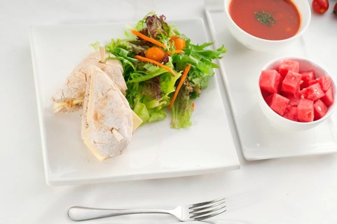 Tuna fish and cheese sandwich with fresh mixed salad