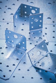 Metal bracket on perforated metallic background Design concept